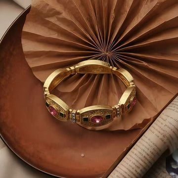 Antique-Gilt Relief Plaque · Zircon Bracelet